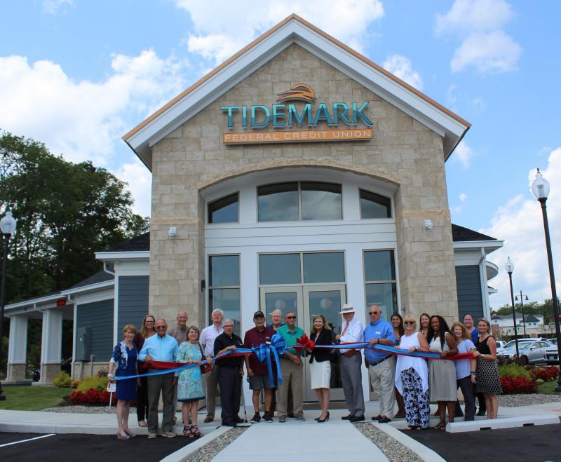 Tidemark FCU ribbon-cutting attendees shown are (l-r) Betsy Reamer, Lewes Chamber of Commerce executive director; Polly Quinn, Tidemark director of marketing; David Smith, Tidemark associate board member; Mike Wigley, principal at Davis, Bowen & Friedel; Gemma Cabrera, Tidemark board member; Lewes Mayor Ted Becker; George Bush, Tidemark board treasurer; Charles Gleason Jr., Tidemark vice chair; Allen Riley, Tidemark vice president of operations; John W. Lewis, Tidemark board chair; Pam Fleuette, Tidemark CEO; Tom Idnurm, Tidemark board member; Wayne Obermire, Tidemark board secretary; Sophia Sawicki, Rehoboth-Dewey chamber; Nick Melvin, Tidemark member experience manager; Kristin Lang-Miller, media consultant; Navatesha N. Taylor, Tidemark member service manager; Amy Shea, Tidemark vice president of accounting and processing; Bonnie Farris, drector of loan operations; and Ashley Tyre, Tidemark vice president of human resources. SUBMITTED PHOTO